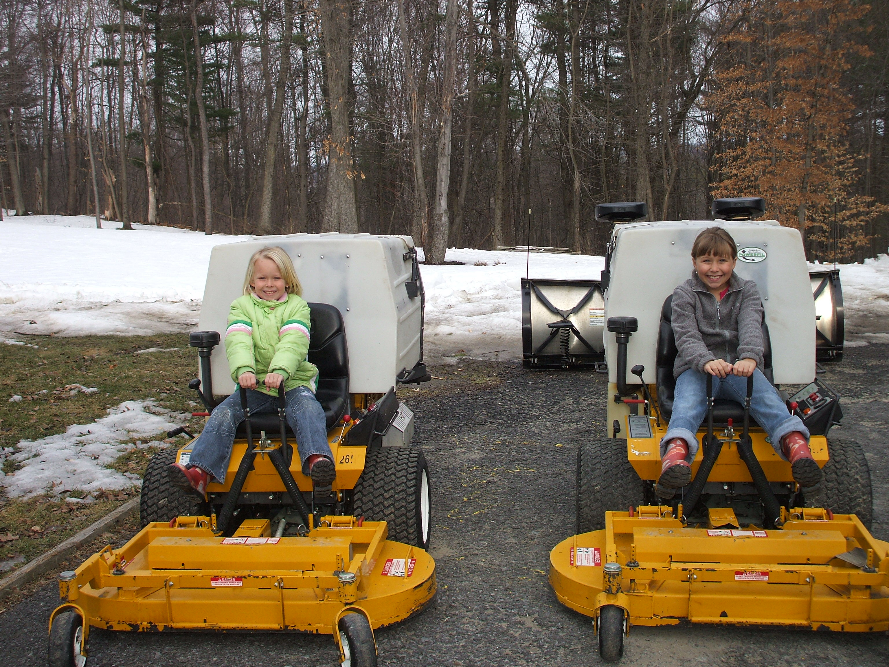 Allie and Kylie Bollman with mowers