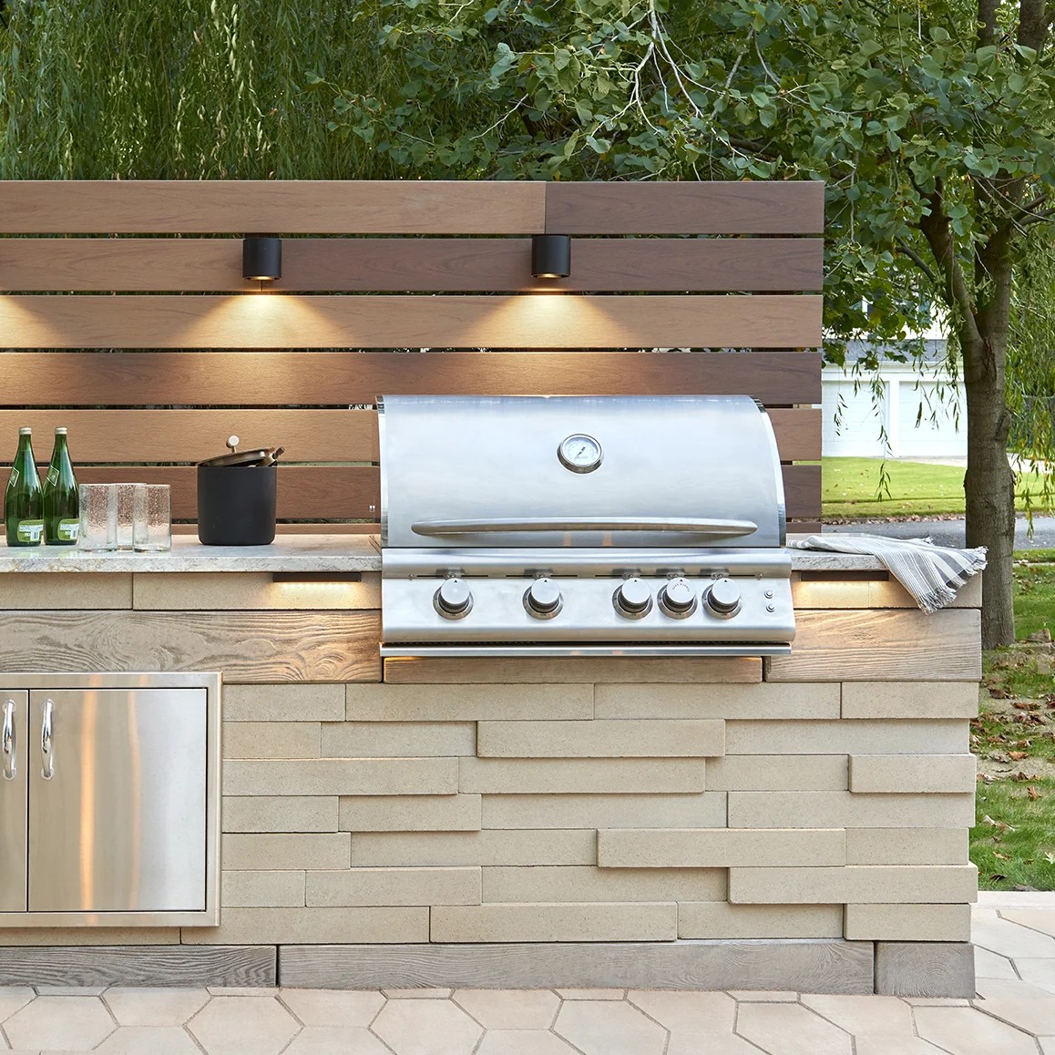 Custom outdoor kitchen transformation by Bollman Landscape
