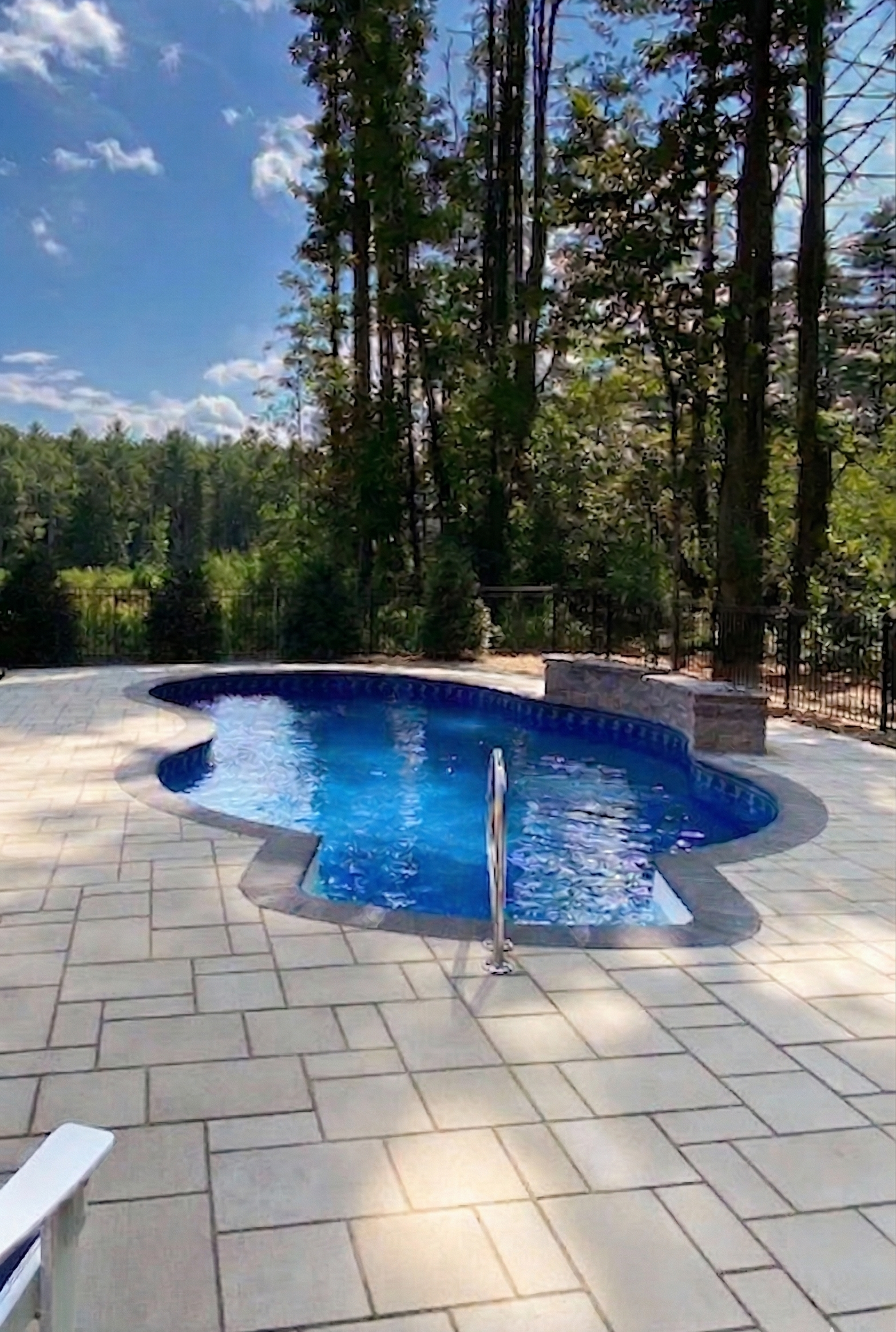 Premium inground pool and paver patio designed and built by Bollman Landscape in the Piedmont Triad
